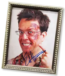 An autographed photo of a man with a tattoo on his face from the movie Hangover 2.