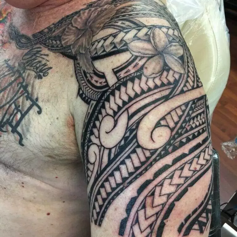 A man renewing his tribal tattoo in San Diego.