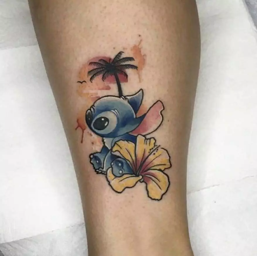 A tattoo with a stitch and a hawaiian palm tree.