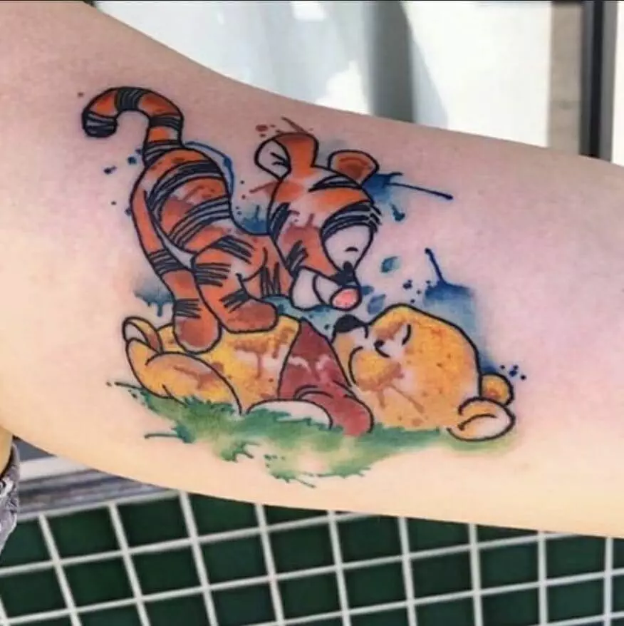 Winnie the pooh and tiger tattoo.