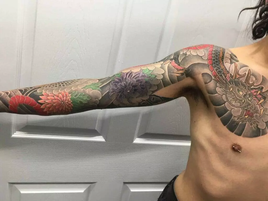 A man with a tattoo on his sleeve.