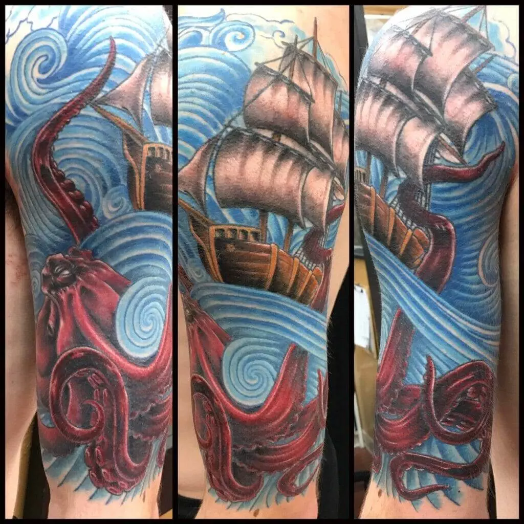 An octopus and ship tattoo on a sleeve.