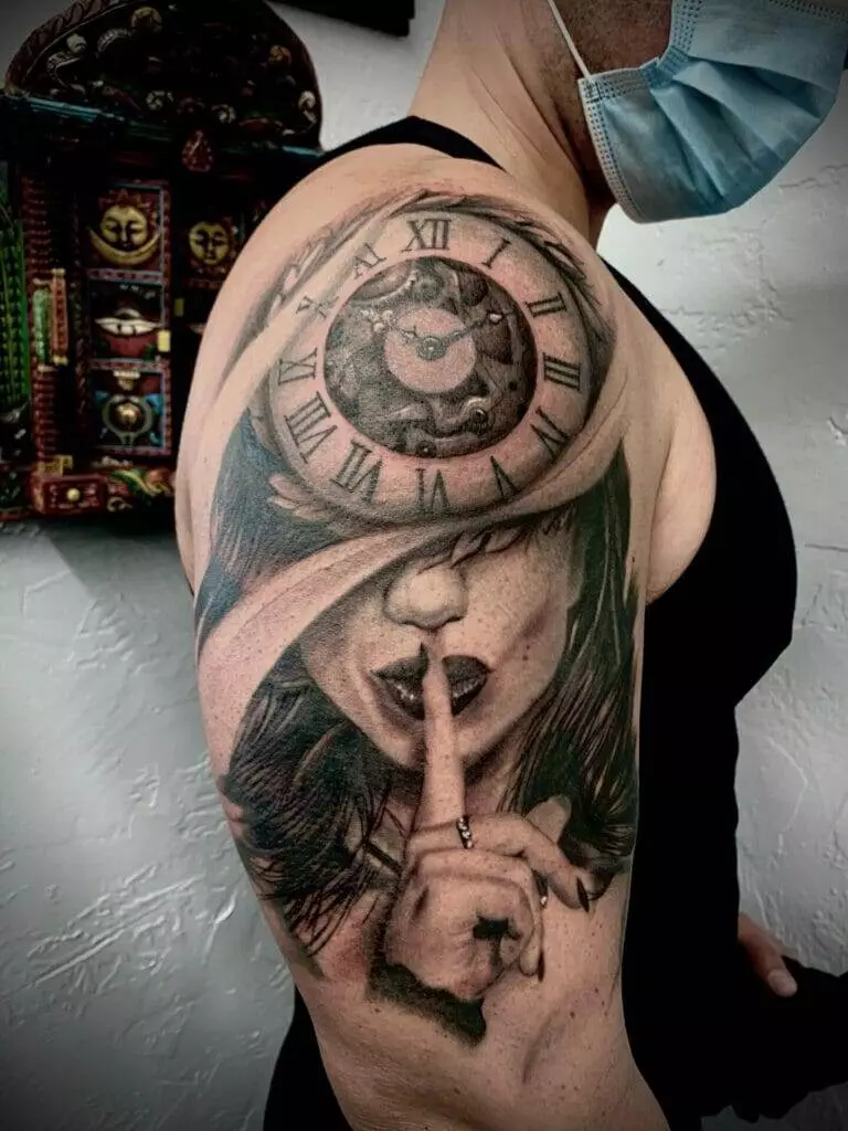 A woman with a clock tattoo on her arm.