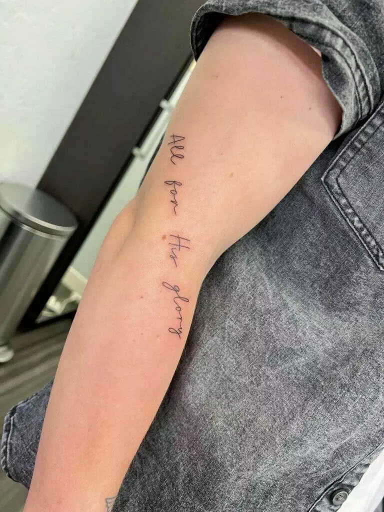 A person with a tattoo on their arm.