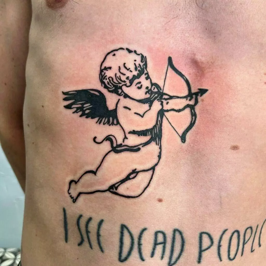 A man with a tattoo of a cupid with a bow and arrow.