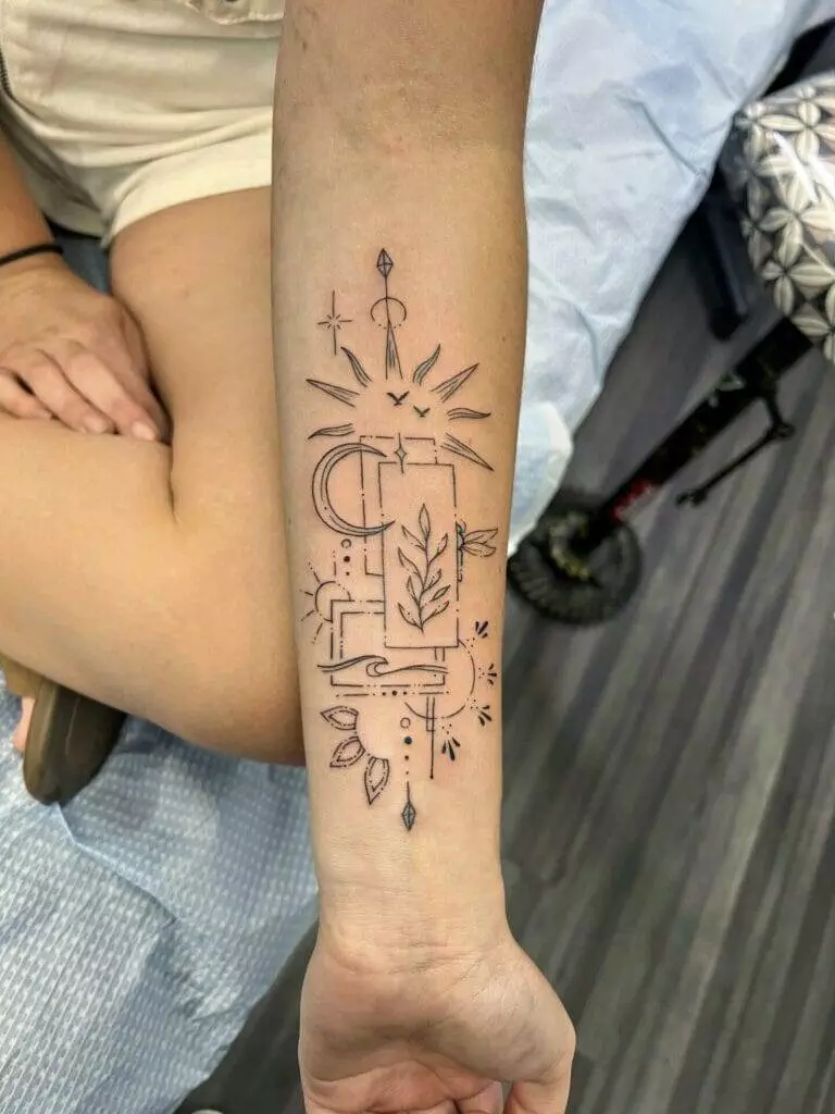 A woman's forearm with a tattoo on it.