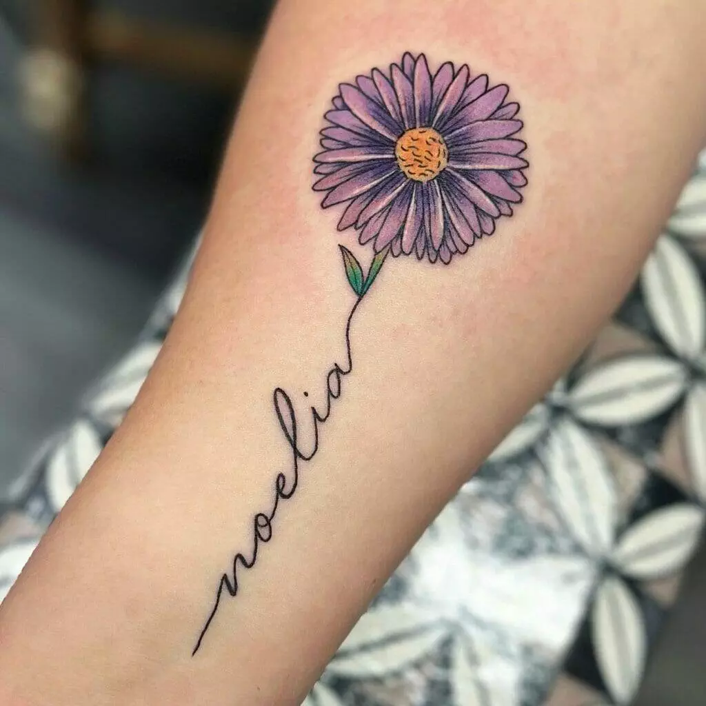 A purple flower with the word nolia written on it.