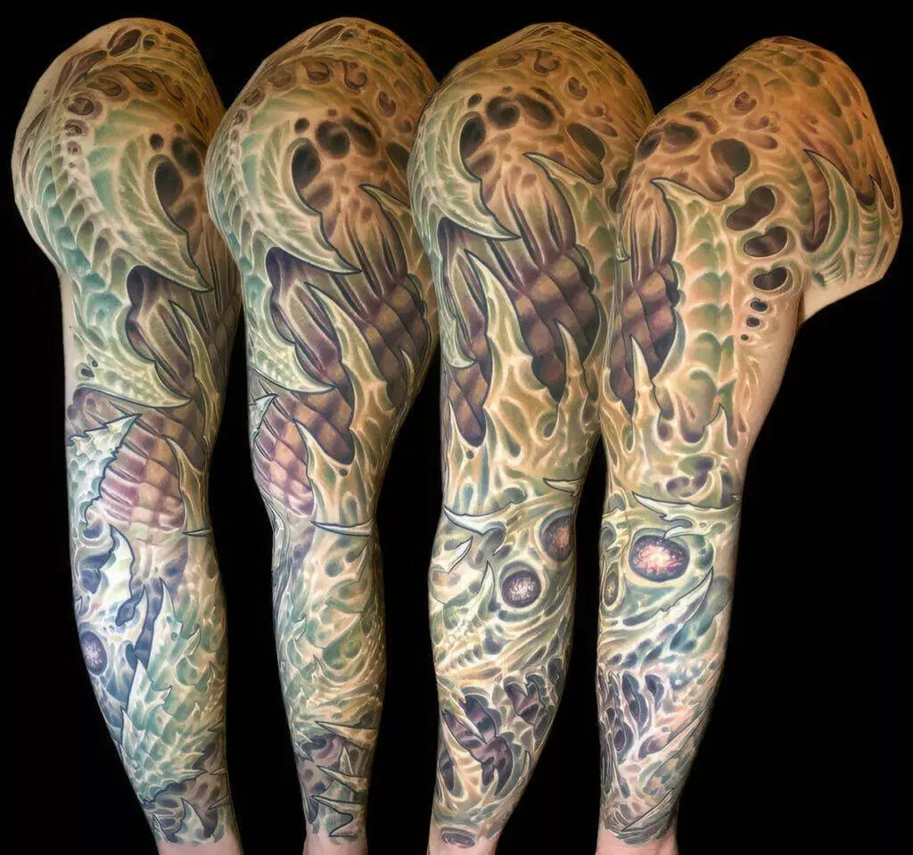 A man's sleeve tattooed with a skull.