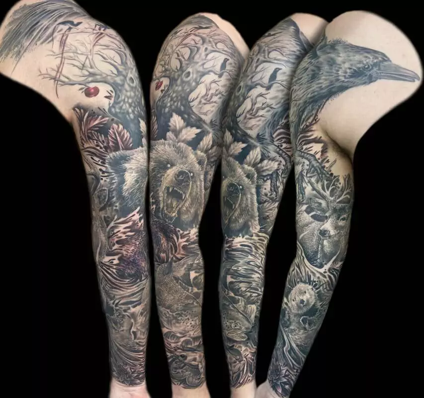 A sleeve of tattoos on a man's arm.