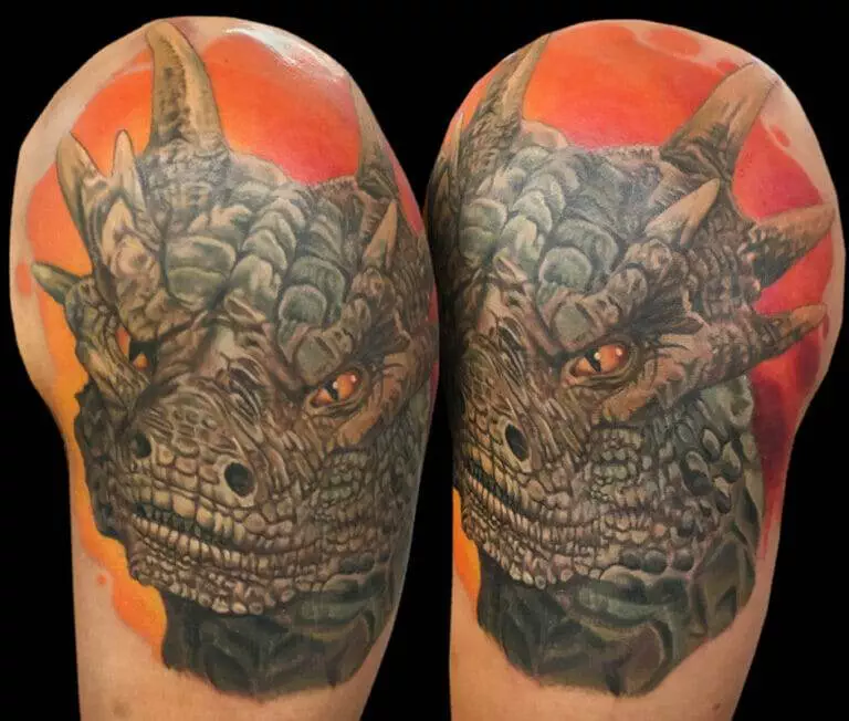 A tattoo of a dragon on a man's sleeve.