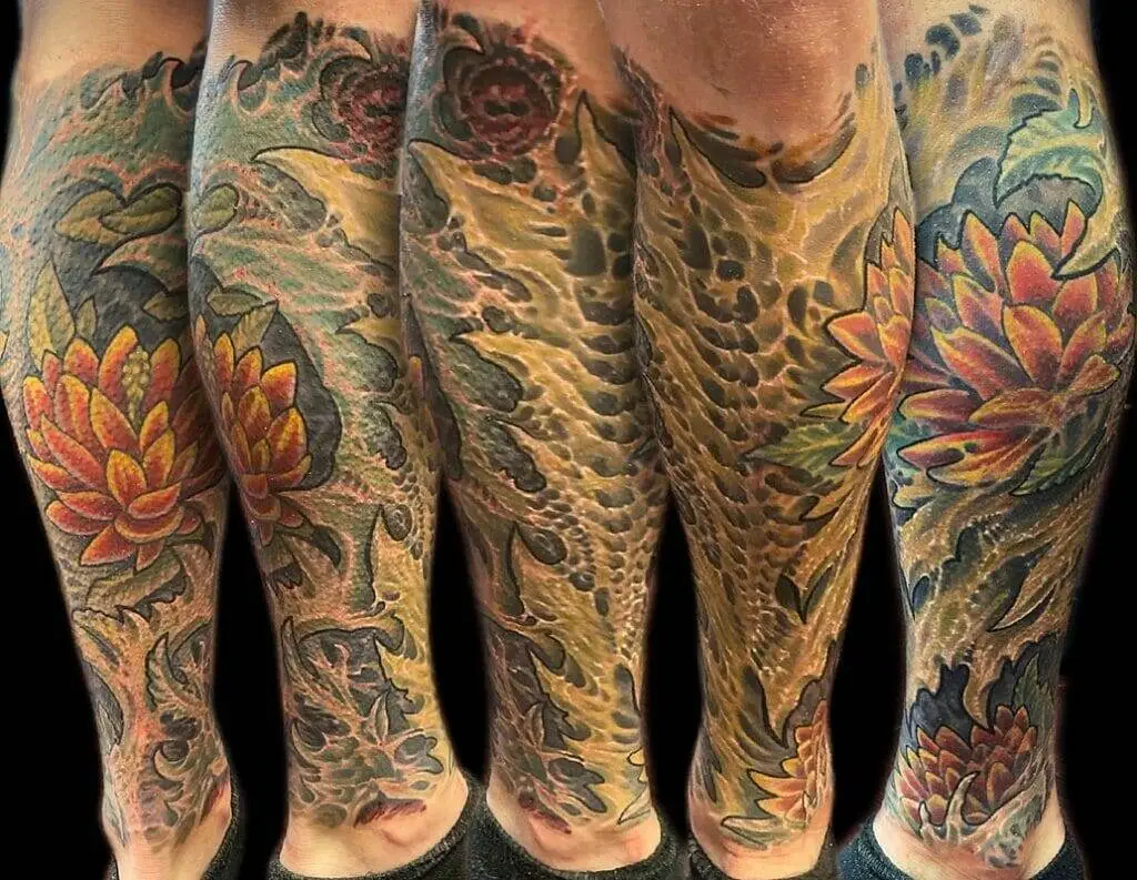 Japanese sleeve tattoos with flowers and leaves.