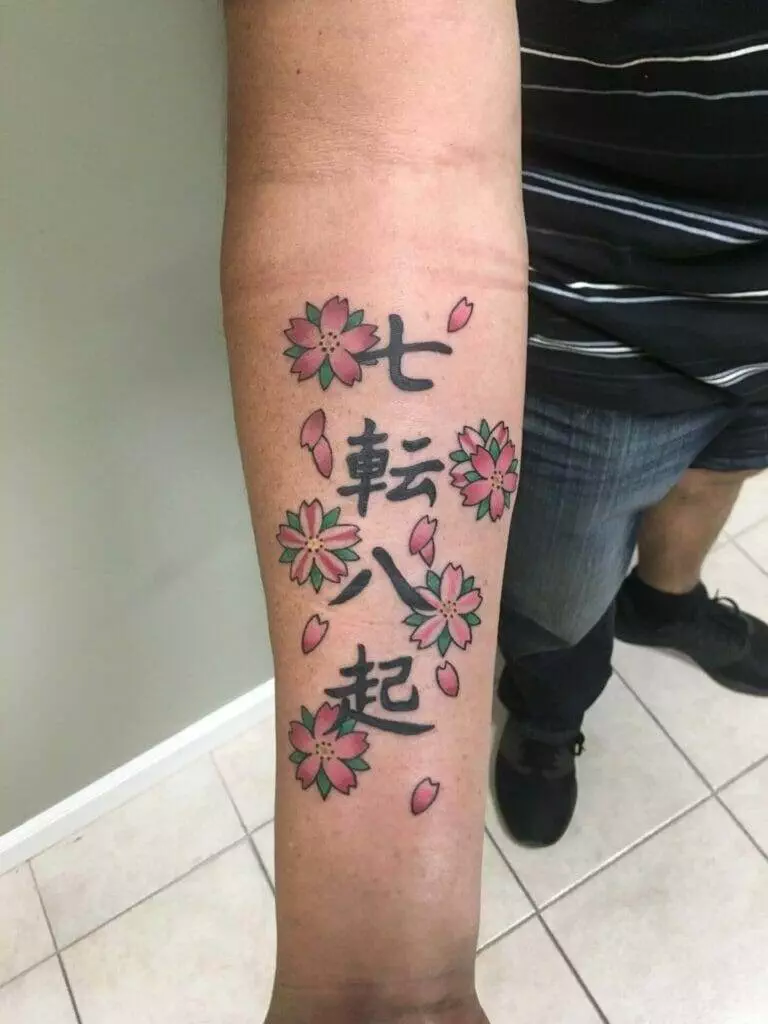 A tattoo with japanese writing on it.