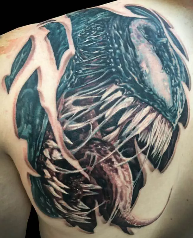 Venom tattoo on the back of a man.