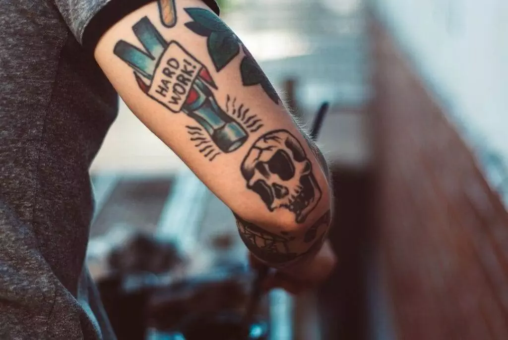 A man with a tattoo on his arm.