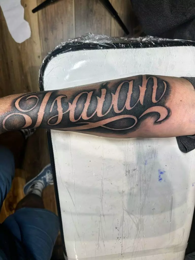 Forearm tattoo showing the name 