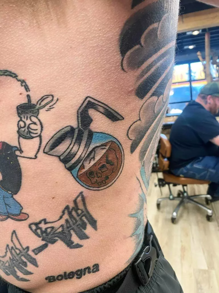 Tattoo of a coffee pot with the word 